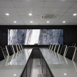A massive video wall featured in a sleek and modern conference room.
