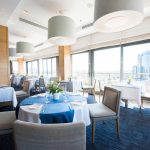 Image is of a modern commercial restaurant space with a blue and white color scheme.