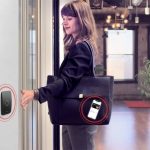 A woman using mobile access control to enter a space.